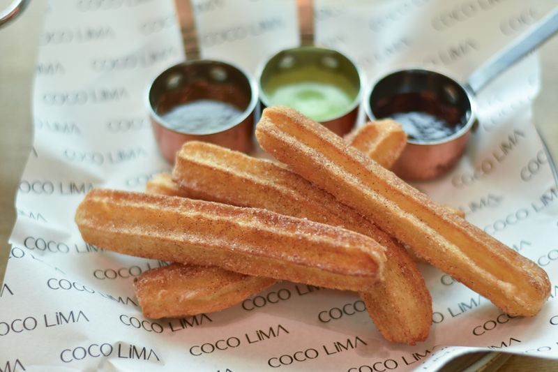 Churro Bites with caramel dipping sauce dessert item